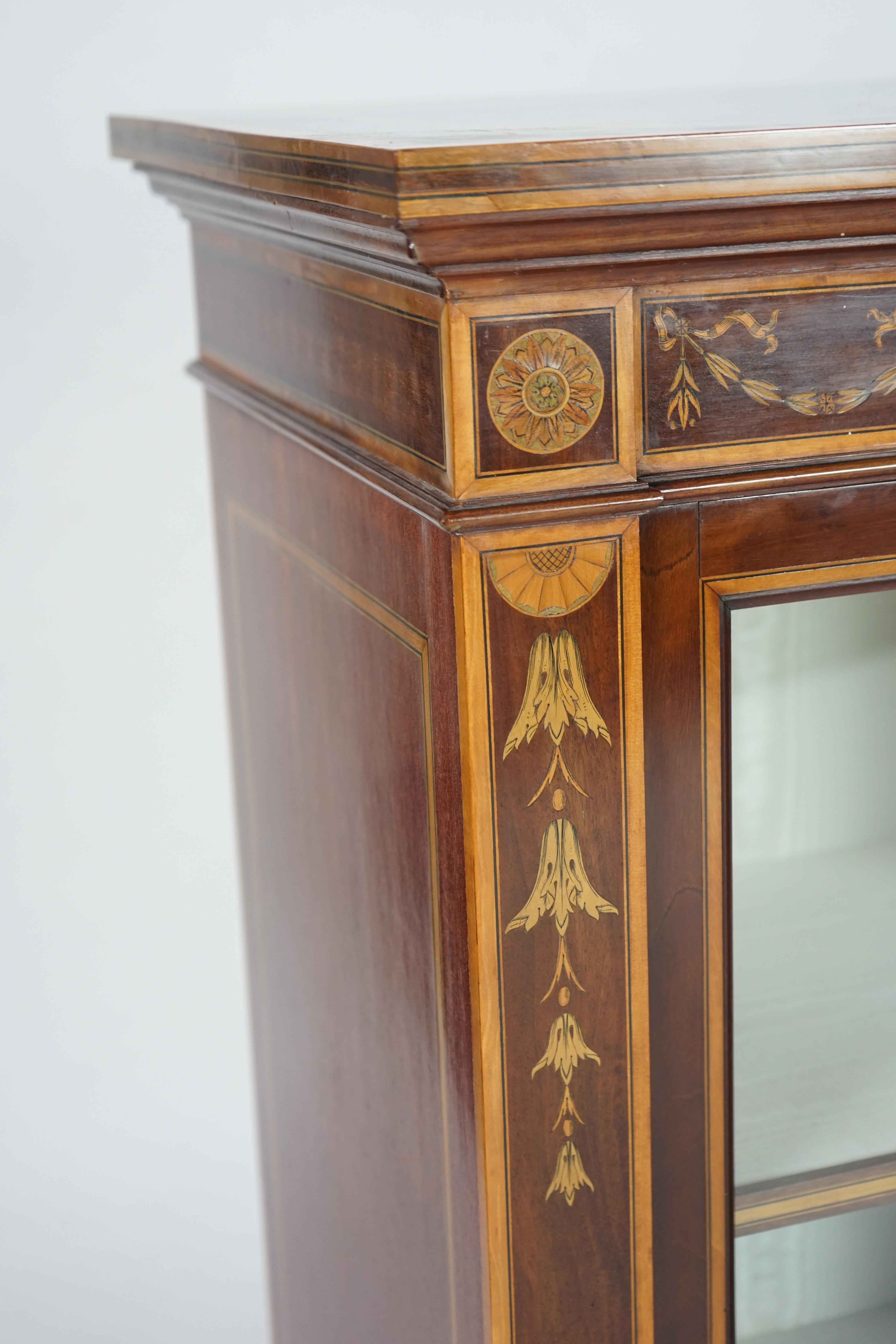 A pair of Edwardian marquetry inlaid and satinwood banded mahogany side cabinets, by Gillows